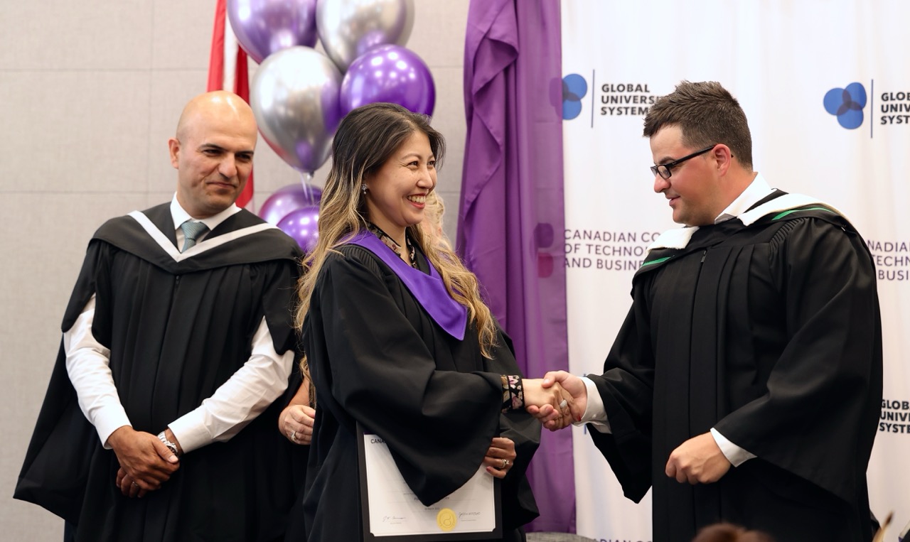Campus director shaking hands with student